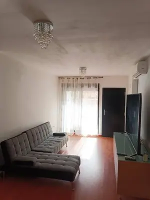 a living room with a couch and a television at Terraced house in natural essence in Favareta