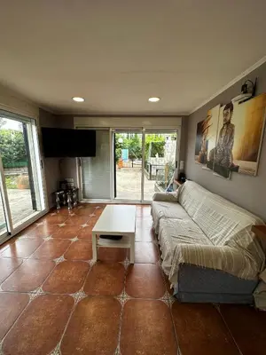 a living room with a couch and a table at Villa Rosa Rasero in Serratella