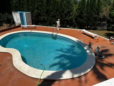 a large swimming pool on top of a roof at Villa Rosa Rasero in Serratella