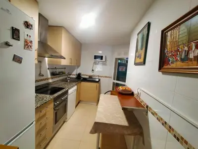 a kitchen with a sink and a counter top at Luminoso piso en edificio de canet de berenguer in Canet de Berenguer
