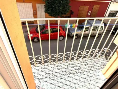 a red car is parked on a balcony at Loft C El Ramellet in Alginet
