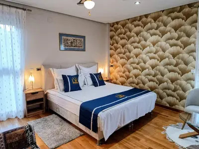 a bedroom with a large bed with blue pillows at Lushville - Luxurious Villa with Pool in Valencia in Campo Olivar
