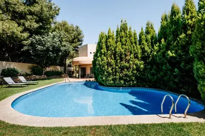 a swimming pool in the yard of a house at Lushville - Luxurious Villa with Pool in Valencia in Campo Olivar