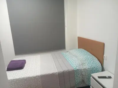 a small bedroom with a bed in a room at Cantarranas in Requena