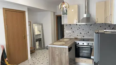 a kitchen with a sink and a stove top oven at Del Mar 1C - New Beach First floor One bed flat in Puerto de Sagunto