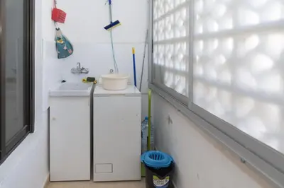 a bathroom with a sink and a window at Amador, 4-J in Cullera