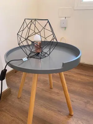 a table with a wire sculpture on top of it at Sueca 1 in Sueca