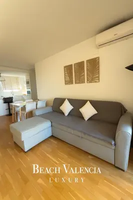 a living room with a couch and a table at BEACH VALENCIA LUXURY B7-23 Apartment with terrace and sea views in Valencia