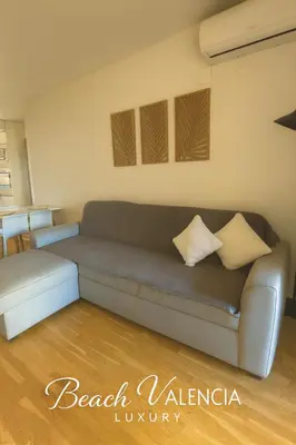 a living room with a couch and a table at BEACH VALENCIA LUXURY B7-23 Apartment with terrace and sea views in Valencia