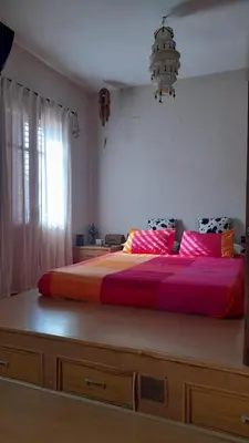 a large bed in a bedroom with a large bedvisor at Zanzibar Beach Puzol relax en la playa cerca de Sagunto y Valencia in Puzol