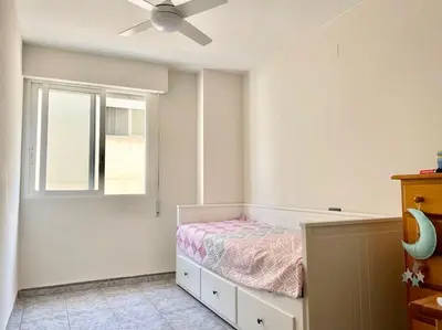 a bedroom with a bed and a window at 3-bedroom apartment with terrace on ground floor in Moncófar