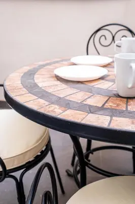 a wooden table with plates and cups on it at Beautiful Suite with Private Terrace in Valencia