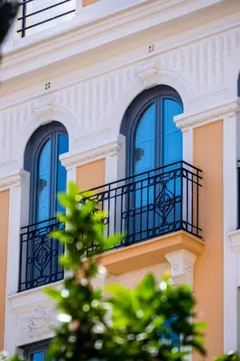 a building with blue windows and a balcony at Beautiful Suite with Private Terrace in Valencia