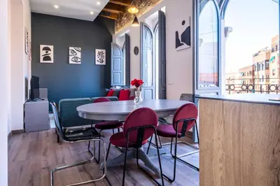 a dining room with a table and chairs at Spacious Penthouse with Massive Terrace in Valencia