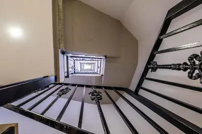 a room with a metal bunk bed with a window at BrightHouse with Warm and Friendly Vibes in Valencia