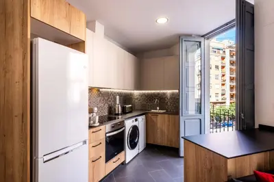 a kitchen with a refrigerator and a dishwasher at Serene Apartment with a Relaxing Atmosphere in Valencia