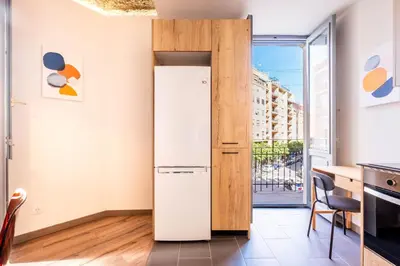 a refrigerator in a kitchen with a window at Amazing Apartment with aFun and Friendly Atmosphere in Valencia