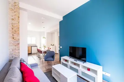 a living room with a couch and a tv at Spacious Apartment with Great Views in Valencia