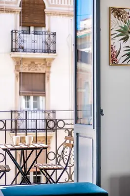 a balcony with a table and chairs on a balcony at Spacious Apartment with Great Views in Valencia