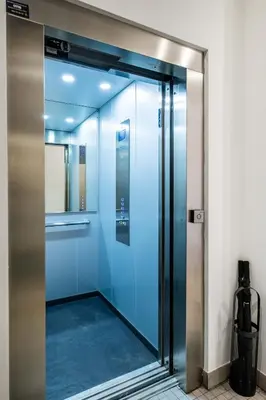 a glass elevator door in a building at Beautifully Designed Studio with Lots of Natural Light in Valencia