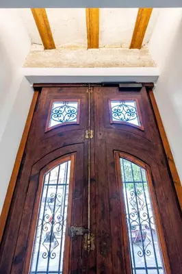 a wooden door with two windows on top of it at Beautifully Designed Studio with Lots of Natural Light in Valencia