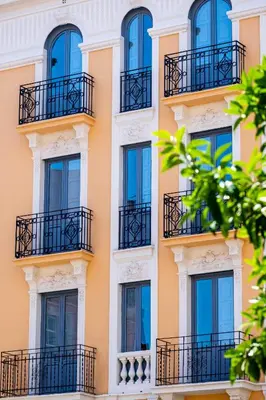 a facade of a building with windows and balconies at Beautifully Designed Studio with Lots of Natural Light in Valencia