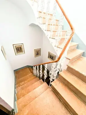 a staircase in a home with white walls and wooden floors at LA TRAVIATA - Buñol in Buñol