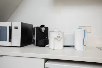 a group of appliances sitting on a counter at ApartUP Las Arenas Beach in Valencia