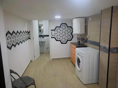 a laundry room with a washer and a washing machine at Loft puerto de Valencia in Valencia