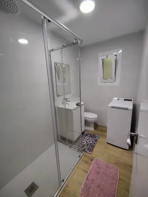 a bathroom with a shower and a toilet at Near Beach Cullera in Cullera