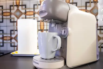 a mixer sitting on a counter with a cup at Quality Apartment with Homely Decor in Valencia