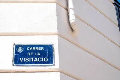 a blue and white sign on a white wall at Quality Apartment with Homely Decor in Valencia
