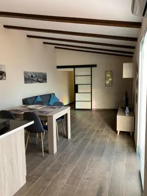a living room with a table and a couch at La Andana in Macastre