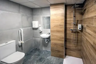 a bathroom with a toilet and a sink and a shower at SOM Hostel Valencia in Valencia