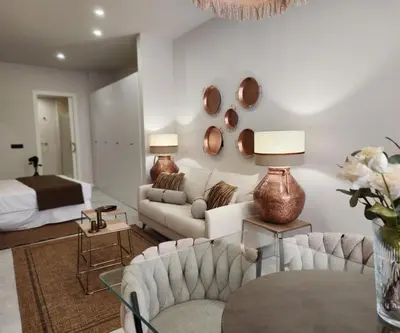 a living room with a couch and a bed at MD Pare Presentat 1 in Valencia