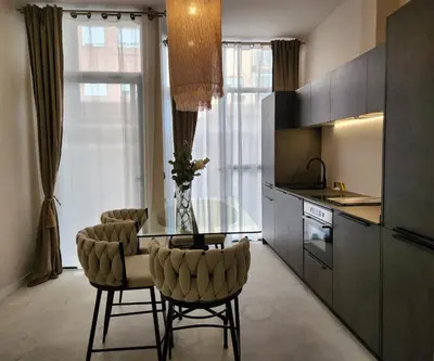 a kitchen with a glass table and two chairs at MD Pare Presentat 1 in Valencia