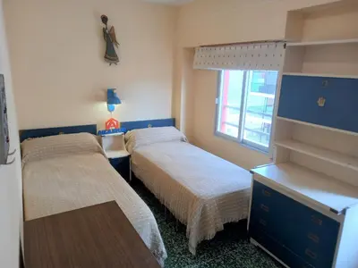 a bedroom with two beds and a window at El Raco, C-9-17 in Cullera