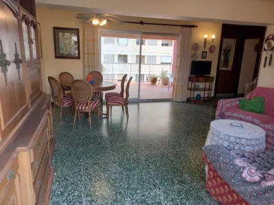 a living room with a couch and a table and chairs at El Raco, C-9-17 in Cullera