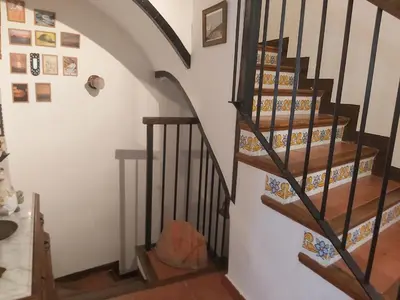 a stairwell in a house with a spiral staircase at Candela de la Murtera in Chelva