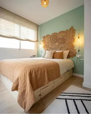 a bedroom with a large bed with a wooden headboard at Casa Xava Valencia in Valencia