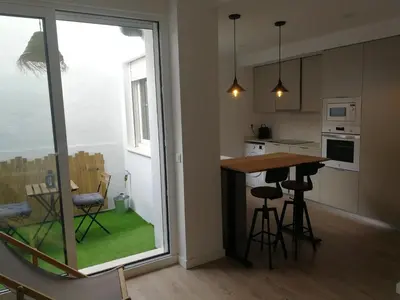 a kitchen with a table and chairs and a window at DeCASTA in Chulilla