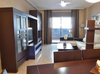 a living room with a couch and a tv at Acogedor apartamento en Burriana centro in Burriana