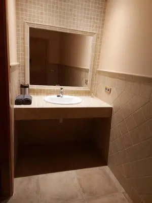 a bathroom with a sink and a mirror at Posada la Toscana in Montroy