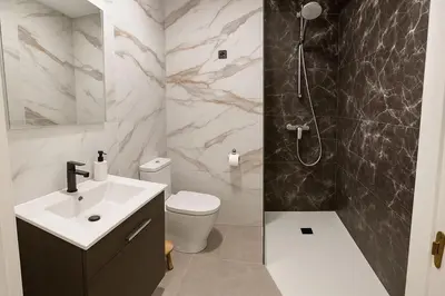 a bathroom with a sink and a shower and a toilet at Del Mar one bed flat in Puerto de Sagunto