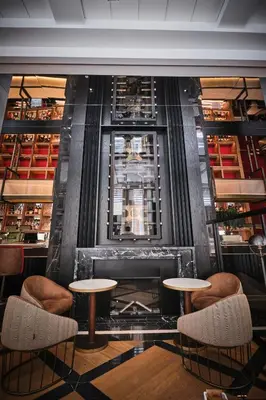 a room with two tables and chairs and a fireplace at ESTIMAR Valencia in Valencia