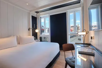 a bedroom with a large bed and a large window at ESTIMAR Valencia in Valencia