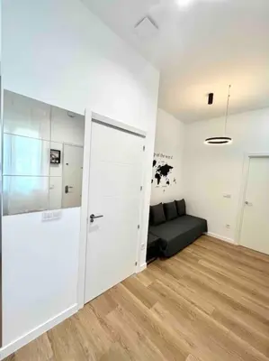 a living room with a couch and a sliding door at Acogedor apartamento 5 personas in Valencia