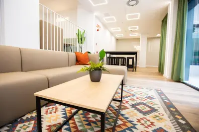a living room with a couch and a coffee table at Micampus Burjassot Parque Student Residence in Burjasot