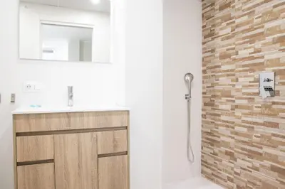 a bathroom with a sink and a shower at Nautical Flats by Concept in Valencia