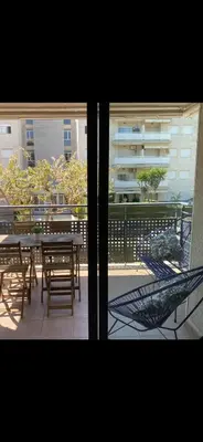 a view of a patio with a table and chairs at Residencial Playa Canet in Canet de Berenguer
